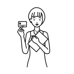 立って書類とカードを手に持つドレスの女性