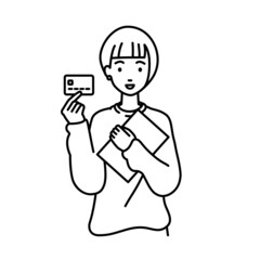 立って書類とカードを手に持つリモートワークの女性