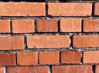 Obraz premium A wall made of red old bricks 