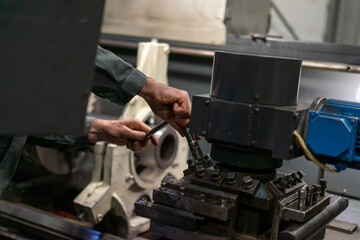 The work of a lathe for cutting the metal parts of the shaft with cutters. The process of setting up a machine for metalworking parts on a lathe.
