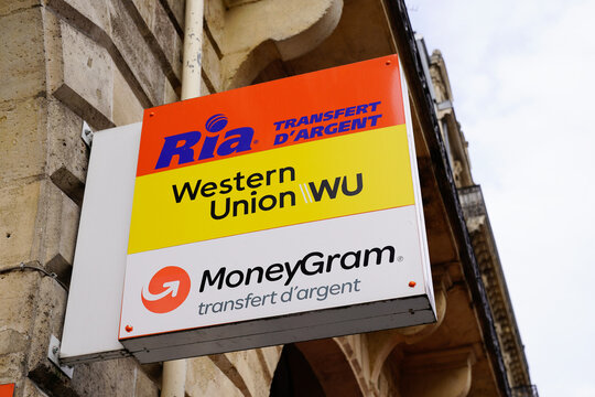 MoneyGram western union and ria money transfer sign text and brand logo front of agency facade service Online