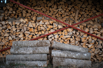 a large stack of chopped fuel wood