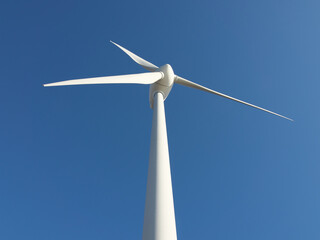 Wind generator against the blue sky.