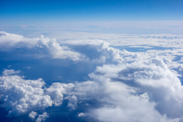 Obraz na płótnie Canvas White fluffy clouds in a bright blue sky
