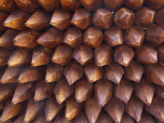 Impregnated pointed wooden piles. Fence elements. Softwood spiked fencing posts