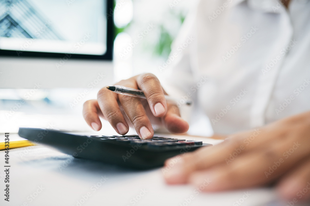 Aufkleber What does that equal to. Shot of an unrecognizable businessperson using a calculator in an office.