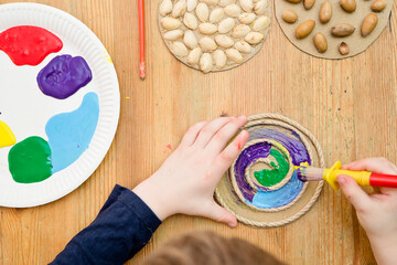 Painting of natural goods. Child's drawing with a brush on touch surfaces glued to paper. Play at home. DIY tasks for kids. Activities for little ones. Sensory education.