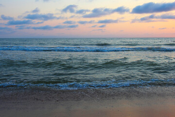 Fototapeta na wymiar Bright beautiful sunset at the calm sea.