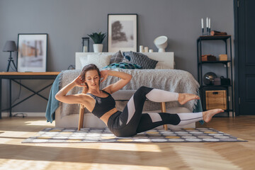 Fit woman doing crunches, abs exercises. Weight loss.