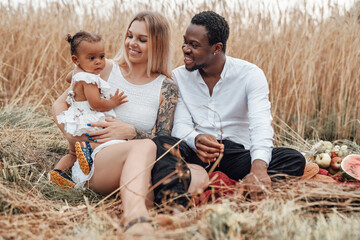 Multiracial happy family of father mother and their daughter