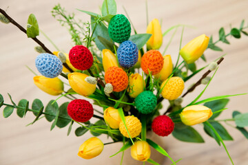 The breeze of spring. Easter composition with tulips and crocheted eggs. Featuring bouquets with handmade accents.