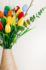 The breeze of spring. Easter composition with tulips and crocheted eggs. Featuring bouquets with handmade accents.