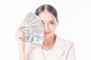 Successful beautiful Asian business young woman holding money US dollar bills in hand isolated on white background with copy space , business concept