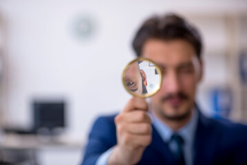 Young male employee working in the office