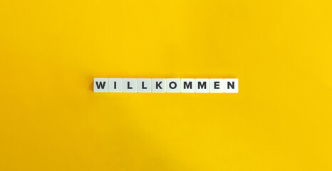 Welcome Word in German Language. Letter Tiles on Yellow Background. Minimal Aesthetics.