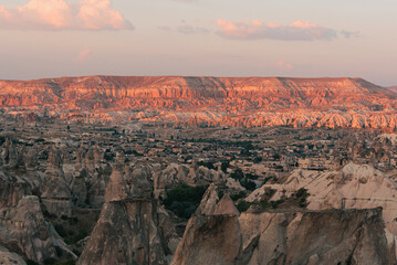 Beautiful Red valley in Goreme, Cappadocia, Turkey. Mountains during sunset. Beauty of nature concept