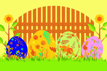 Happy Easter. Easter eggs. Decorating easter eggs on grass on a landscape background and wooden fence 