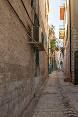 Fototapeta na wymiar Old houses on an old narrow street in the old part of Nazareth, northern Israel