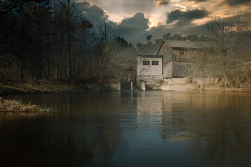 Obraz premium Palace, water mill and other historic buildings from the Polish countryside.