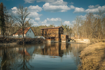 Fototapeta na wymiar Palace, water mill and other historic buildings from the Polish countryside.