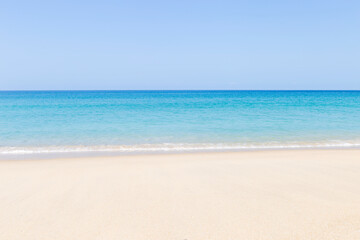 Fototapeta na wymiar Summer beach background, outdoor day light, empty clean fine sandy beach, tropical island