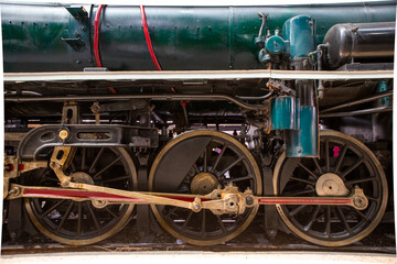 Closeup Wheels and drive device of old steam locomotive