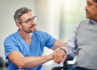 Hes the doctor to depend on when movement becomes limited. Shot of a nurse helping a senior man in a wheelchair.