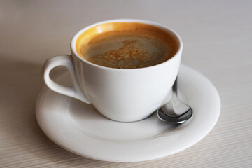 Obraz premium White cup with coffee on the table