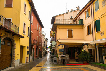 An historic street in Lazise on the shore of lake Garda at Christmas. In Verona Province, Veneto, north east Italy
