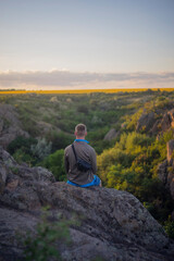 man at sunset in the canyon Ukraine