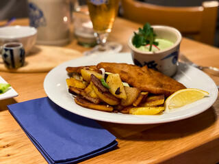 Frankfurter Schnitzel, pork schnitzel with fried potatoes and green sauce. Dreieich, Hesse, Germany