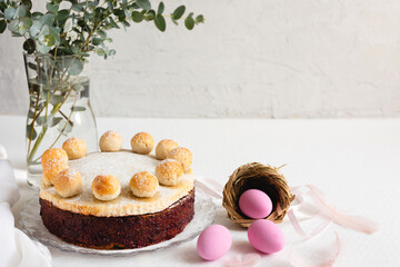 Fototapeta na wymiar Easter cake simnel for breakfast on a grey background.