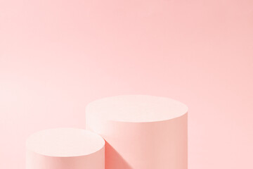 Fashion pastel pink stage with top of two round podiums mockup in sunlight, shine soft light wall, copy space. Trendy template showcase for presentation cosmetic product, goods, advertising, design.