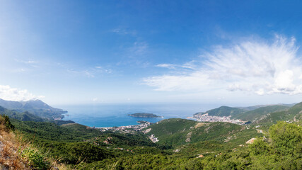 Panoramic view of the city of Budva, Montenegro. Beautiful view from the mountains to the Adriatic Sea. The time of the year is summer.