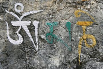 buddhist painting on rocks in bhutan 