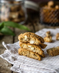 Front view of Italian bakery cantuccini with almond over wood brown background