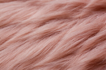 Pink faux fur as background, closeup view