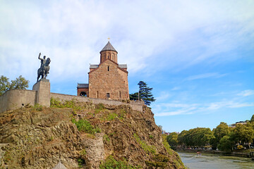 Metekhi Church with a Monument of King Vakhtang Gorgasali on Mtkvari Riverbank's Rocky Outcrop, Old Tbilisi, Georgia