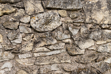 Texture of a stone wall. Old castle stone wall texture background. Stone wall as a background or texture. Part of a stone wall, for background or texture.
