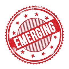 EMERGING text written on red grungy round stamp.