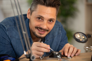 pocket watch being repaired by watch maker close-up