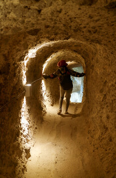 Visitor Heading to the Exit of the Tunnel at Medieval Cave City of Vardzia on Erusheti Mountain Near Aspindza Town, Georgia