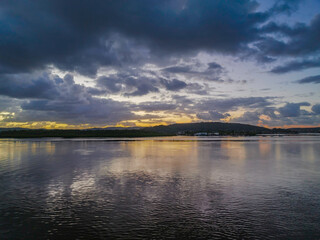 Sunrise and rain clouds waterscape