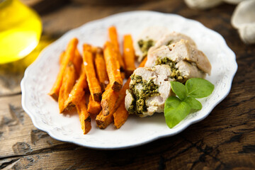 Chicken with pesto and sweet potato fries