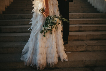 Happy couple in love. Gorgeous bride and stylish groom. Romantic moments of newlyweds. Wedding photo.