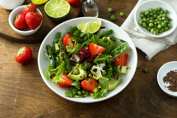 Healthy leaf salad with strawberry and avocado