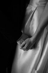 The back view of a young caucasian couple.  Walking hand in hand.