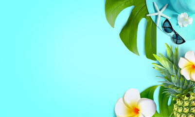 Summer background design concept. Top view with starfish, pineapple, hat, flower plumeria and monstera leaves on blue background.