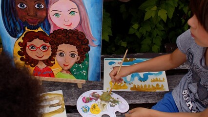 Mother with kids spend time together. Portrait painting workshop for children. Learn to draw from simple techniques to improve creative skills. 
