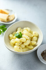 Homemade potato dumplings with black pepper and cheese